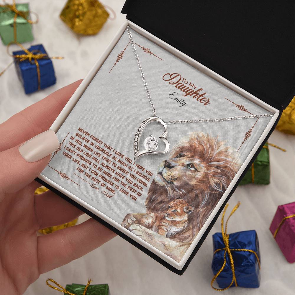a gift box with a stainless steel heart shapped pedant necklace with a large cz diamond and small ca chip diamonds on the perimeter A