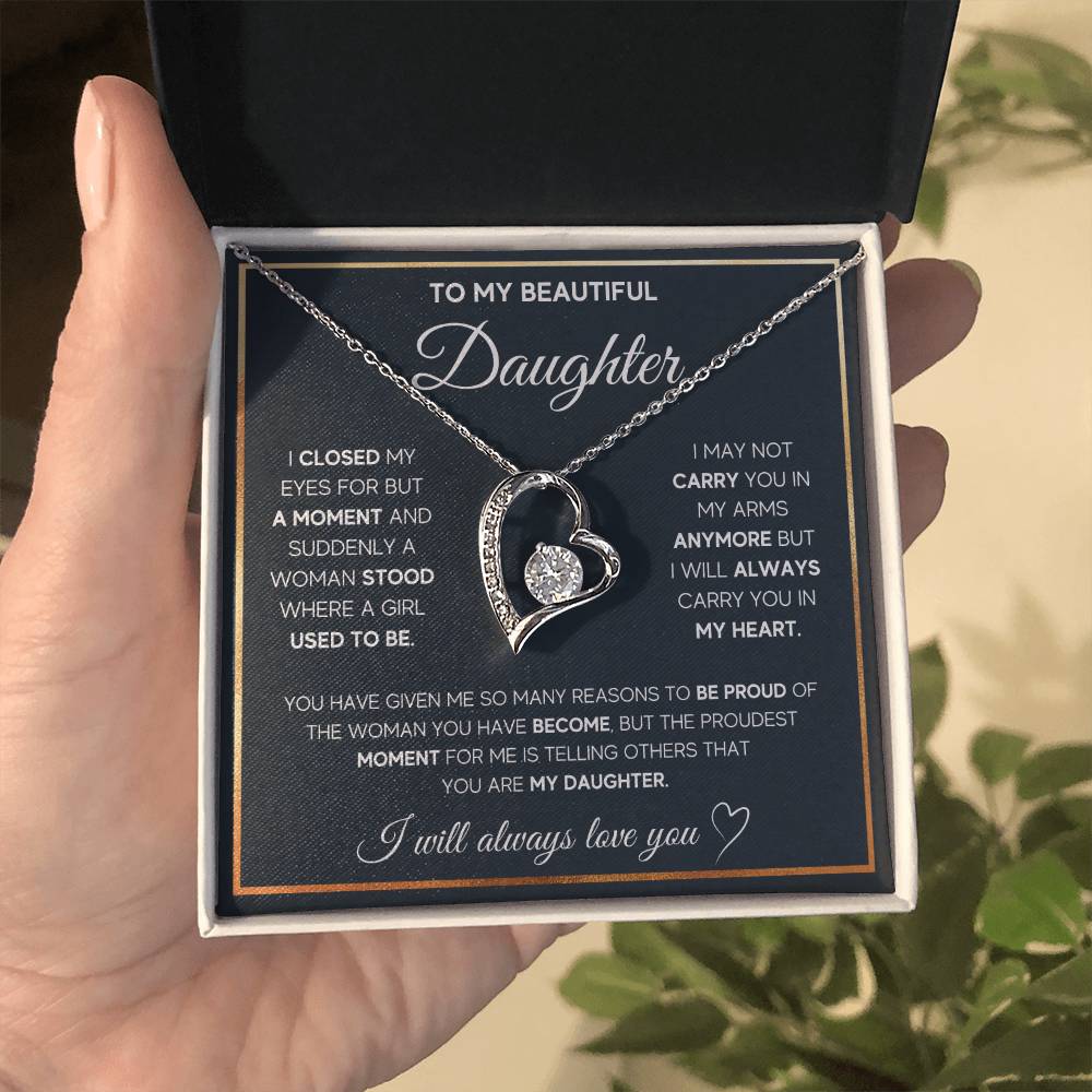 The dazzling Forever Love Necklace is sure to make her heart melt! This necklace features a stunning 6.5mm CZ crystal surrounded by a polished heart pendant embellished with smaller crystals to add extra sparkle and shine. Beautifully crafted with either a white gold or yellow gold finish, be sure to give her a classic gift she can enjoy everyday.