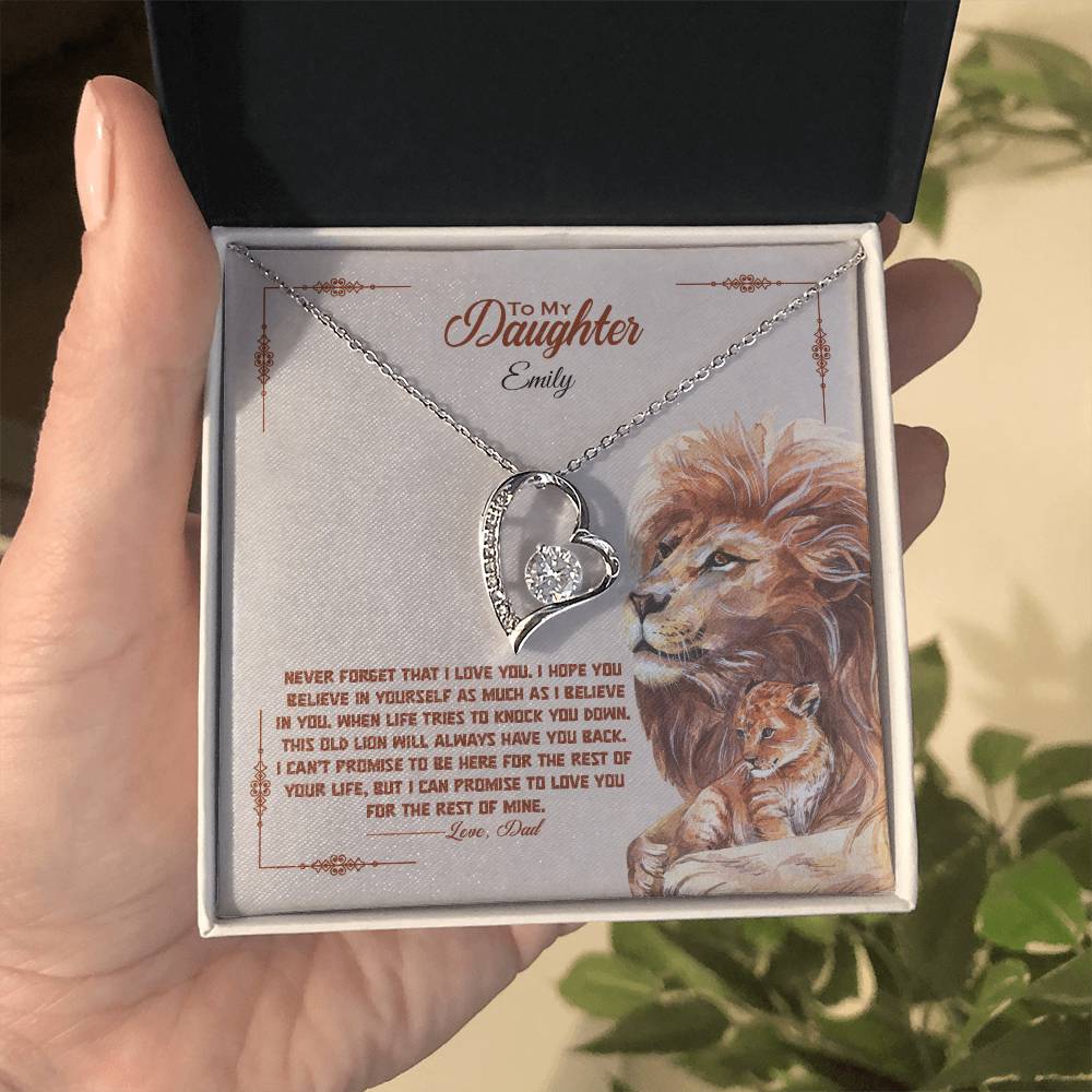 a gift box with a stainless steel heart shapped pedant necklace with a large cz diamond and small ca chip diamonds on the perimeter A