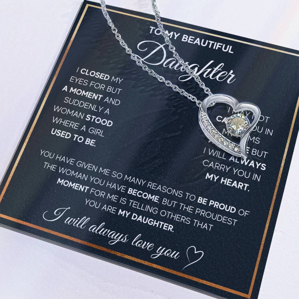 The dazzling Forever Love Necklace is sure to make her heart melt! This necklace features a stunning 6.5mm CZ crystal surrounded by a polished heart pendant embellished with smaller crystals to add extra sparkle and shine. Beautifully crafted with either a white gold or yellow gold finish, be sure to give her a classic gift she can enjoy everyday.