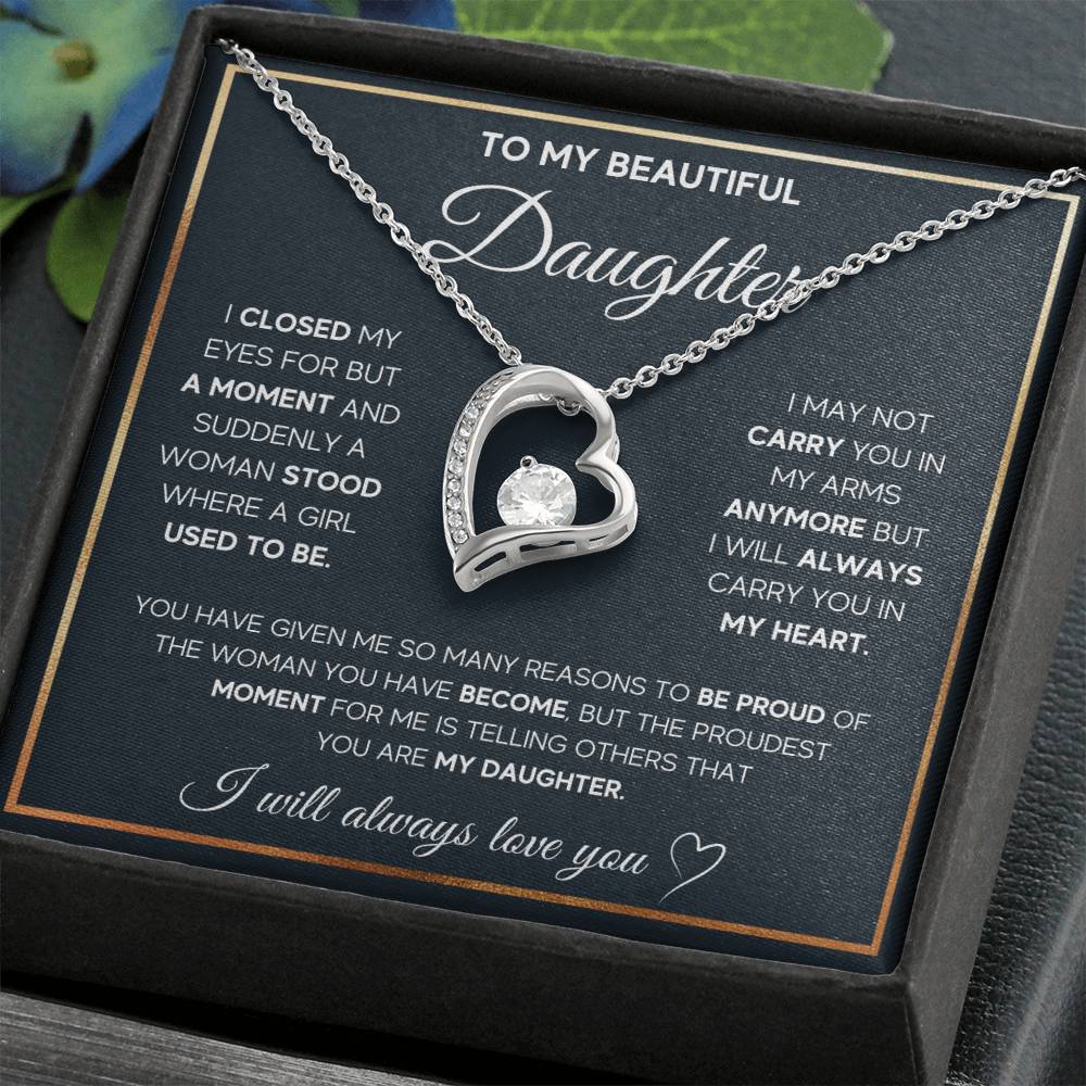 The dazzling Forever Love Necklace is sure to make her heart melt! This necklace features a stunning 6.5mm CZ crystal surrounded by a polished heart pendant embellished with smaller crystals to add extra sparkle and shine. Beautifully crafted with either a white gold or yellow gold finish, be sure to give her a classic gift she can enjoy everyday.