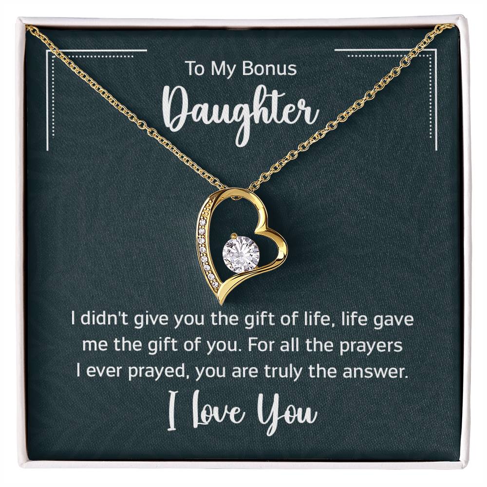 Gift box with a heart pendant necklace on It. 14k white gold finish or 18k yellow gold finish 6.5mm round cut cubic zirconia stone Pendant dimensions: 0.8" (2.2cm) height / 0.7" (1.8cm) width Adjustable chain length: 18" - 22" (45.72cm - 55.88cm) Lobster clasp attachment