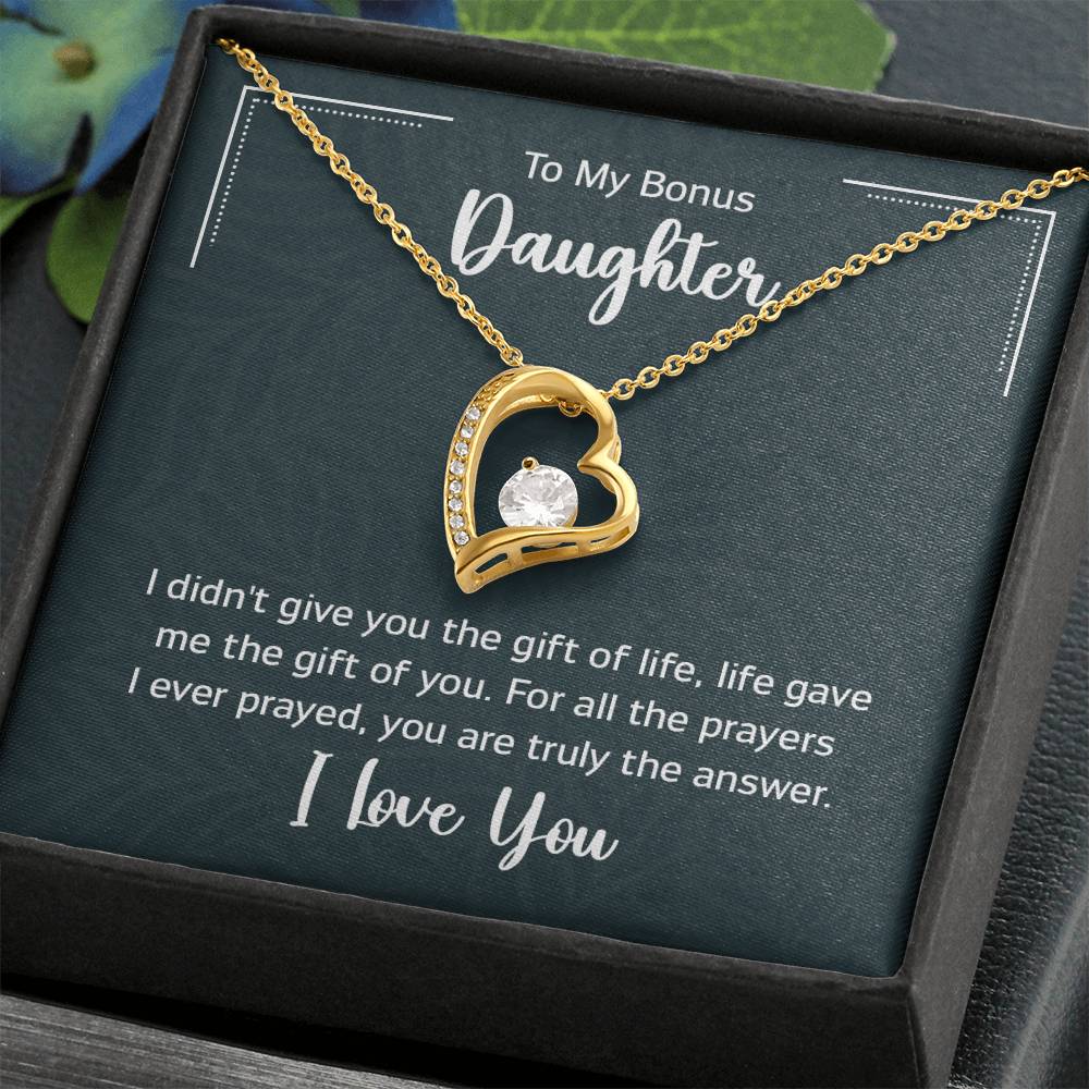 Gift box with a heart pendant necklace on It. 14k white gold finish or 18k yellow gold finish 6.5mm round cut cubic zirconia stone Pendant dimensions: 0.8" (2.2cm) height / 0.7" (1.8cm) width Adjustable chain length: 18" - 22" (45.72cm - 55.88cm) Lobster clasp attachment
