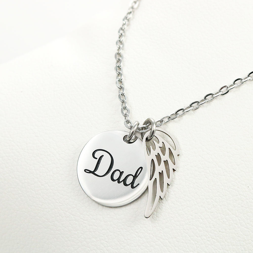 Message card with a memorial necklace Dad Product specifications: Polished Stainless Steel and 18k Yellow Gold over Stainless Steel. Pendant Dimensions, Circle 0.5" (13mm), Wing 0.625" (10mm) Adjustable 18"-22" cable chain Lobster clasp closure.