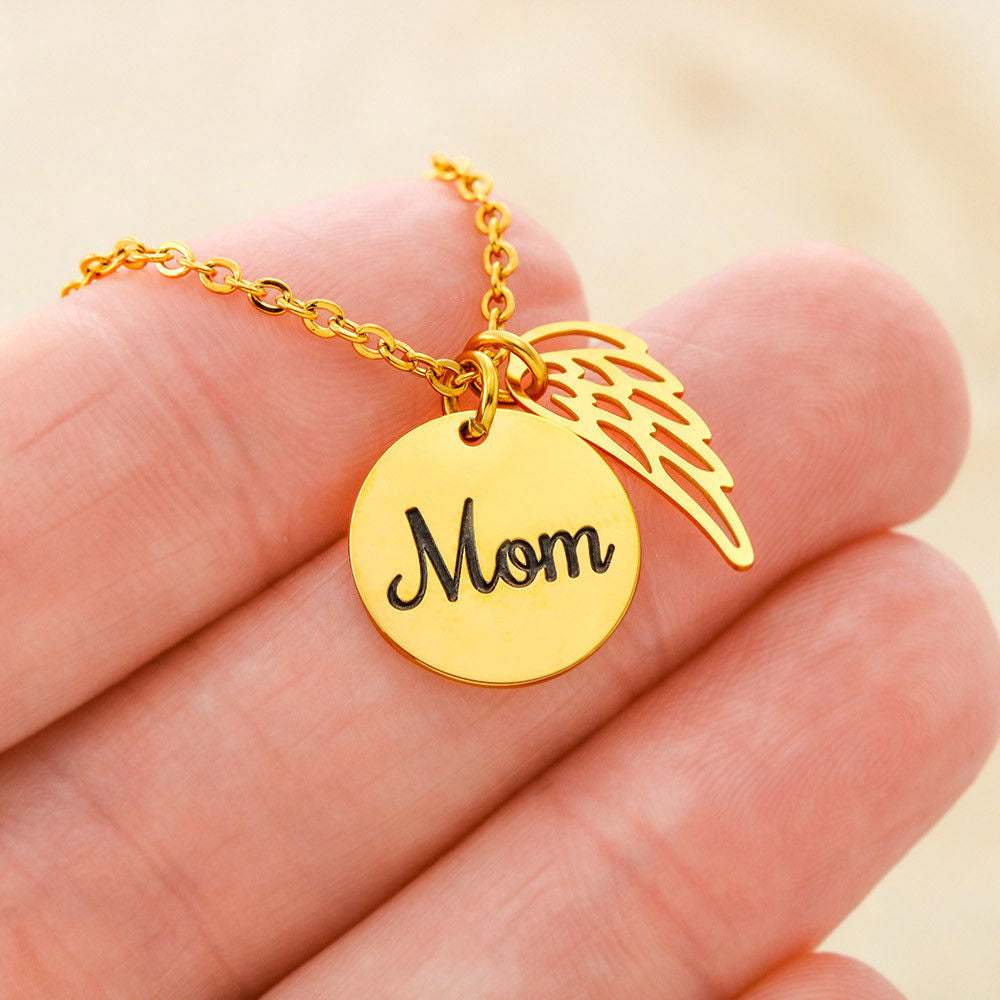 Message card with a memorial necklace Dad Product specifications: Polished Stainless Steel and 18k Yellow Gold over Stainless Steel. Pendant Dimensions, Circle 0.5" (13mm), Wing 0.625" (10mm) Adjustable 18"-22" cable chain Lobster clasp closure.