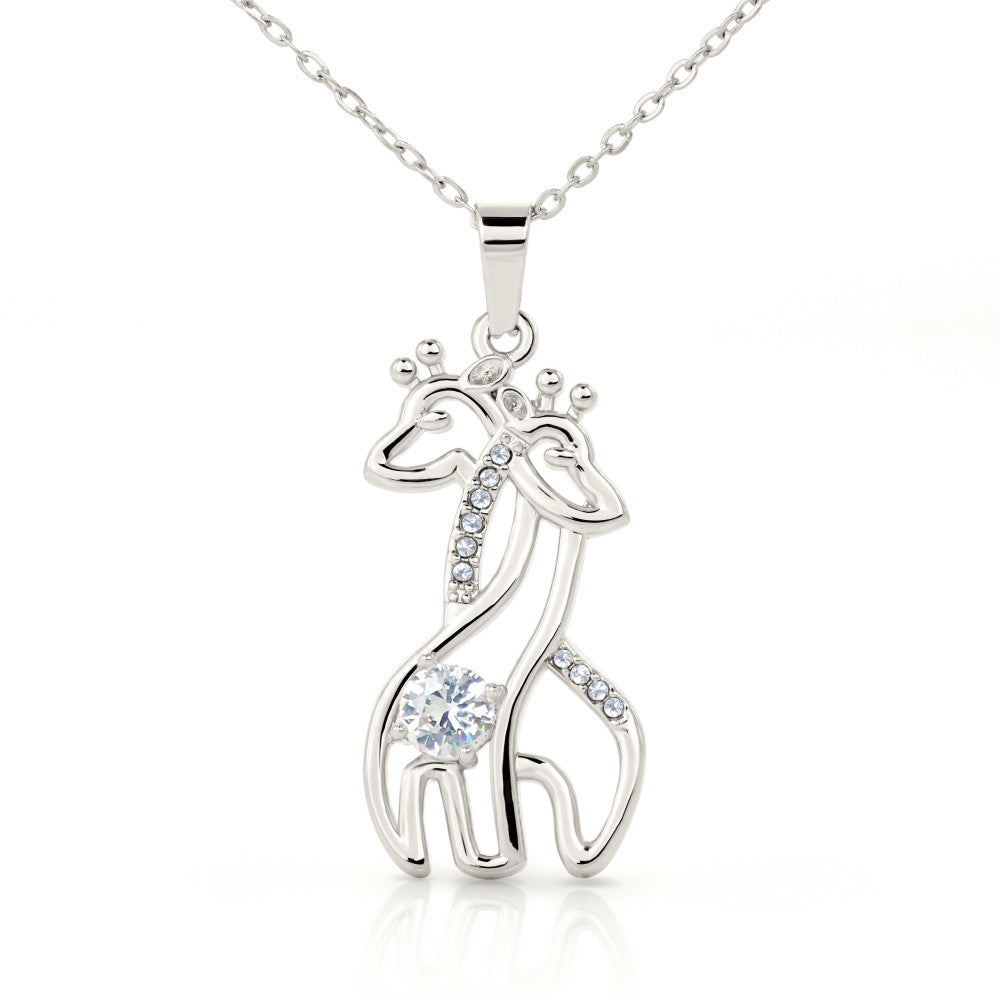gift card with 2 giraffes intertwined necklace pendant necklace on it and