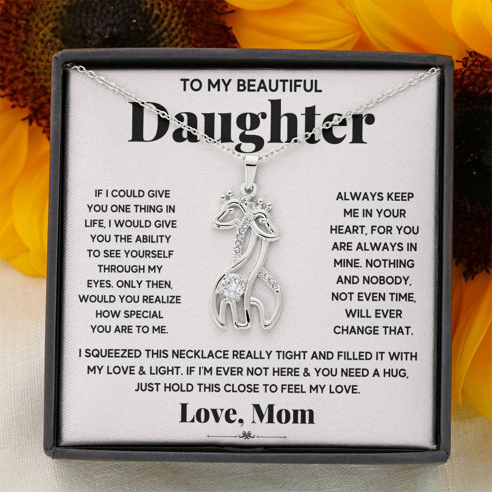 gift card with 2 giraffes intertwined necklace pendant necklace on it and
