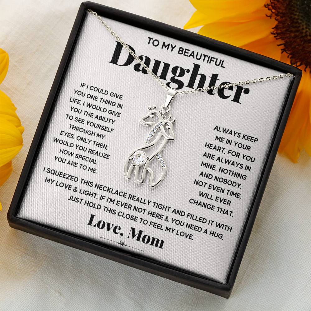 gift card with 2 giraffes intertwined necklace pendant necklace on it and