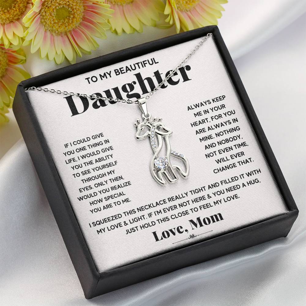 gift card with 2 giraffes intertwined necklace pendant necklace on it and