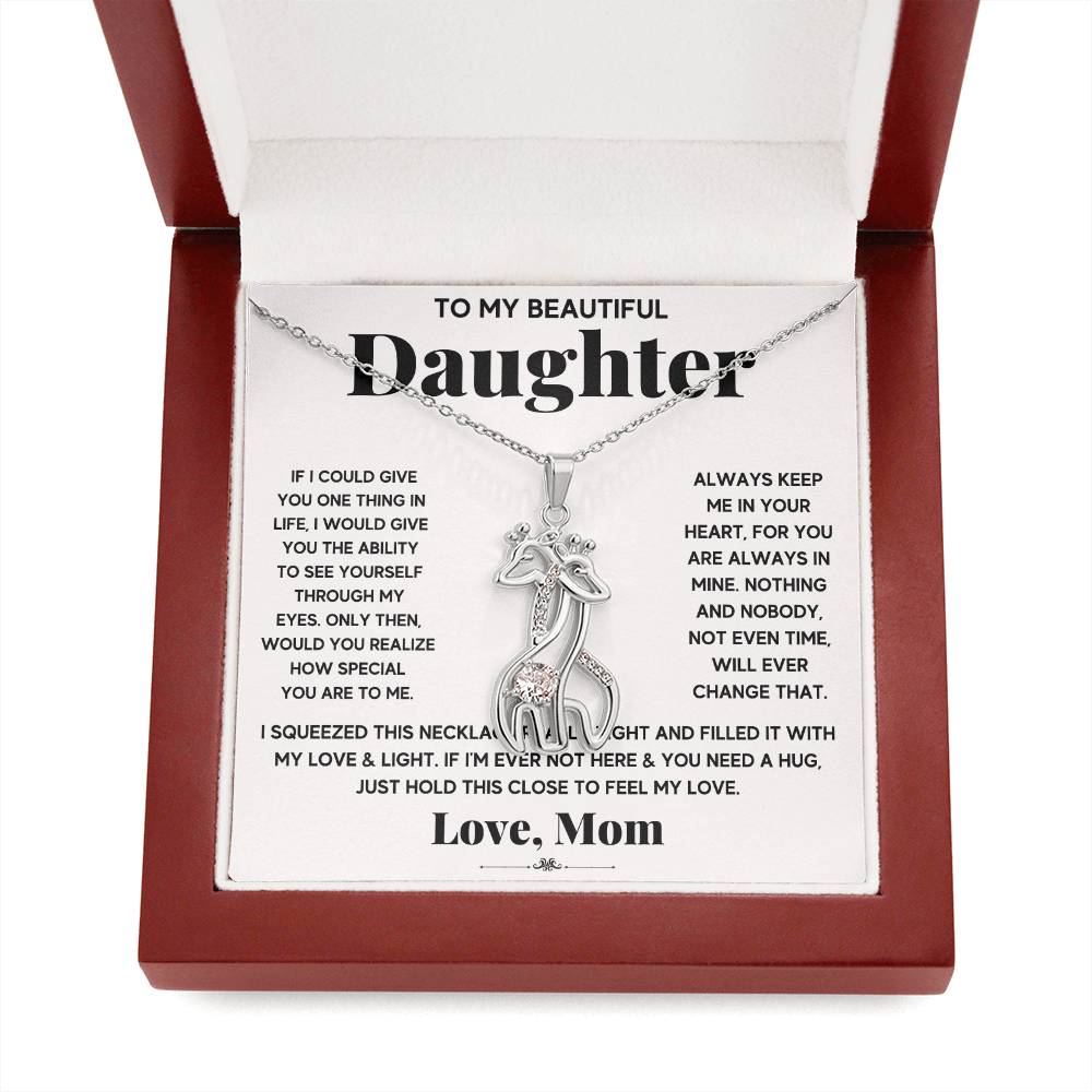 gift card with 2 giraffes intertwined necklace pendant necklace on it and