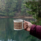 Red diamond quilt mug brown background
