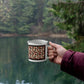 Red diamond quilt mug black background