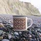 Red diamond quilt mug brown background